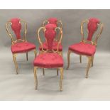 A set of four 19th century giltwood framed upholstered salon chairs Each shaped back with central