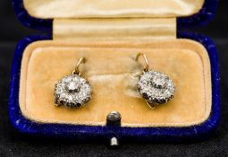 A pair of Victorian unmarked gold diamond set earrings Each of flowerhead drop form.