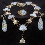 A suite of Chinese silver mounted lavender jade jewellery Comprising: a necklace set with Buddhas,