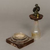 A 19th century Dobereiner lamp or tinder box The top set with a seated figure with hinged arms