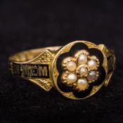 A Victorian (1866) 18 ct gold enamel and seed pearl mourning ring The florally set seed pearls