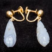 A pair of 14K gold mounted lavender jade earrings Each of carved drop form. Each 4 cm high.