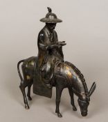 A 19th century Chinese patinated bronze group Formed as a scholarly figure seated atop a horse.