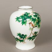 A Japanese silver wire cloisonne vase Of ovoid form with white ground and decorated with a bird