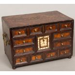 An 18th century Indo-Portuguese parquetry inlaid table cabinet Fitted with an arrangement of