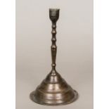 A 16th century Persian candlestick The slender knopped stem standing on a spreading domed foot,