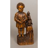 A 19th century carved wooden sewing companion Formed as a young child collecting fruit,