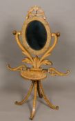 A 19th century Indian marquetry inlaid campaign shaving/washstand The oval bevelled plate with