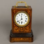 A 19th century French marquetry inlaid rosewood cased mantle clock by Bolviller The white enamelled