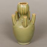 A Chinese celadon ground flower vase The central florally modelled neck surrounded by five further