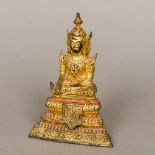 An antique Thai gilt bronze Buddha Typically modelled seated in the lotus position,