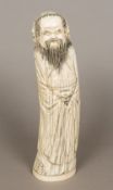 A late 19th/early 20th century Chinese ivory figural carving Modelled as a bearded gentleman in