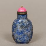 A Chinese lapiz lazuli snuff bottle Of typical form, set with a quartz mounted stopper. 6.