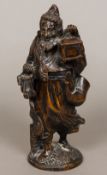 A 19th century Black Forest carved wooden tobacco box Formed as a bearded figure holding a lantern