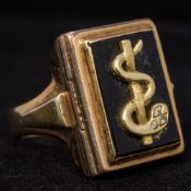 A diamond set 835 gold medical doctors ring With Caduceus mounted hinged lidded compartment.