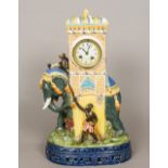A large majolica pottery clock Formed as an elephant being ridden by a monkey smoking a pipe,