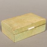 An early 20th century shagreen covered cigarette box Of domed hinged rectangular form with ivory