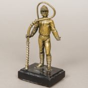 A Victorian bronze model of a jockey, possibly a watch stand Modelled standing in racing attire,