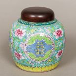A 19th century Chinese famille verte porcelain ginger jar Decorated in the round with floral sprays