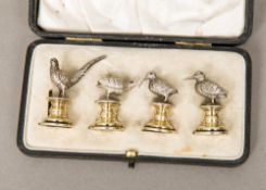 A cased set of four Edwardian silver menu holders, three hallmarked for London 1906,