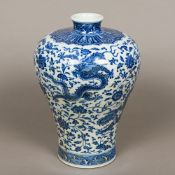 A Chinese blue and white porcelain Meiping vase Worked with dragons amongst lotus strapwork,