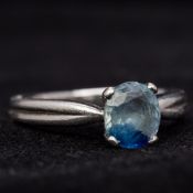 A platinum and sapphire solitaire ring