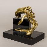 A contemporary modernist brass sculpture