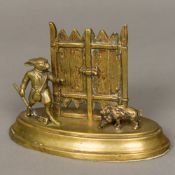 A 19th century bronze desk letter stand Formed as a rabbit with a shotgun hunting a boar.