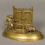 A 19th century bronze desk letter stand Formed as a rabbit with a shotgun hunting a boar.
