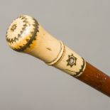 A Georgian pique inlaid ivory handled walking stick The knopped stem with drilled hole for