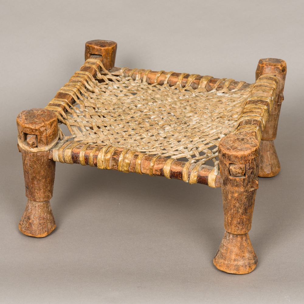 An African tribal stool The lattice worked seat animal hide. 21.5 cm high.