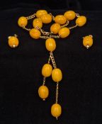 A 9 ct gold and amber bead necklace