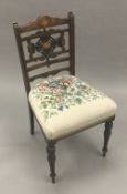 An Edwardian inlaid bedroom chair with tapestry upholstered seat