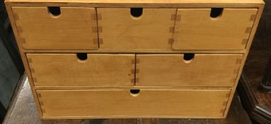 A watchmakers wooden chest of drawers