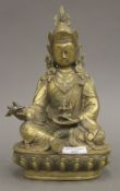 A Chinese brass model of Buddha holding a vajra