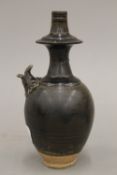 A Chinese porcelain water dropper, with all over olive green glaze.