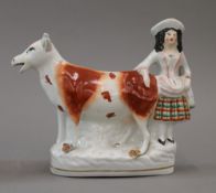 A 19th century Staffordshire flatback cow creamer