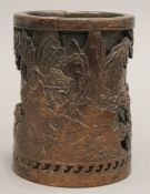 A Chinese patinated bronze brush pot