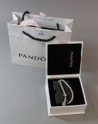 A silver Pandora bracelet,