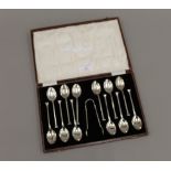 A cased set of silver teaspoons and tongs, hallmarked for Birmingham 1926,