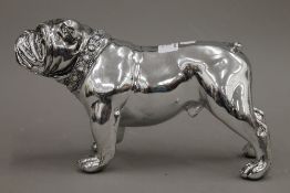 A small silvered model of a bulldog