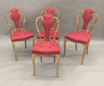 A set of four 19th century giltwood framed upholstered salon chairs,