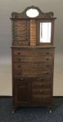 An American oak smoking/cocktail cabinet by The Ransom & Randolph Co of Toledo USA. 164 cm high.