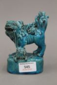 A Chinese porcelain temple lion, with all over turquoise glaze.