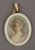 A Victorian portrait miniature on ivory depicting a young girl,