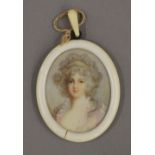 A Victorian portrait miniature on ivory depicting a young girl,