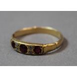 A 9 ct gold diamond and ruby ring (1.