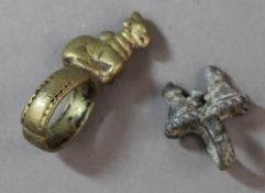 An antique brass ring mounted with an animal and another