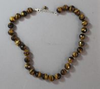 A cased silver and tigers eye necklace