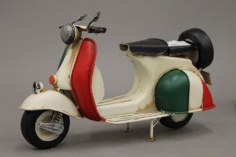 A tin plate model of a scooter